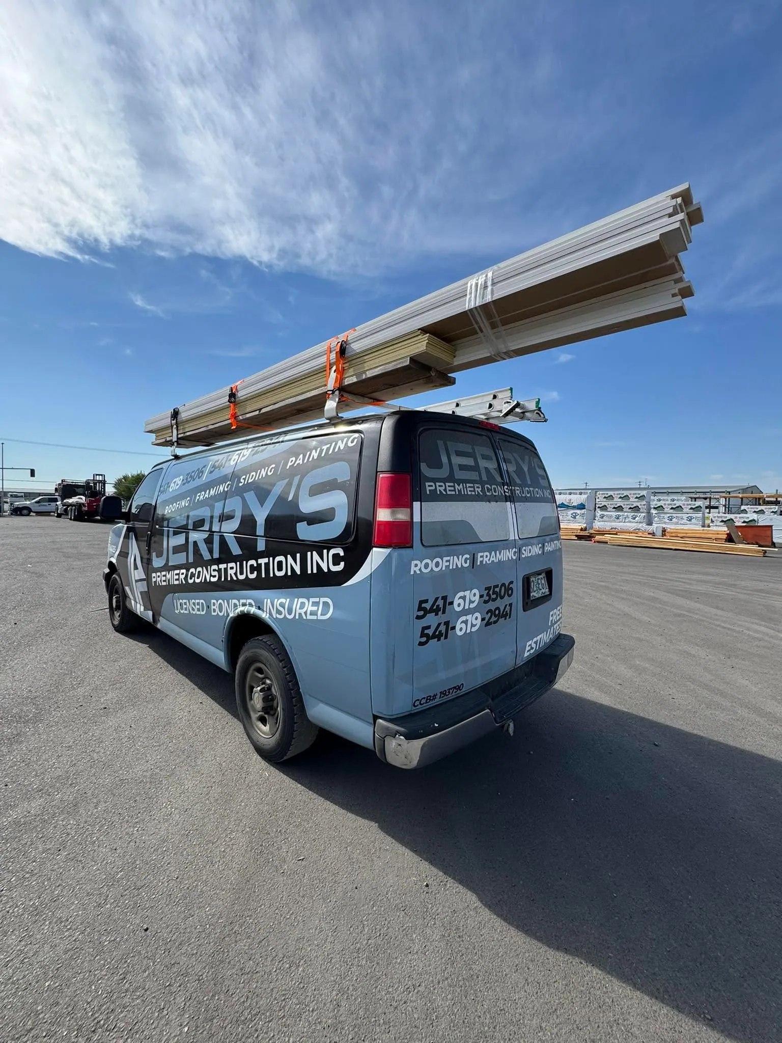 The Jerry's Construction van loaded with lumber on the roof rack